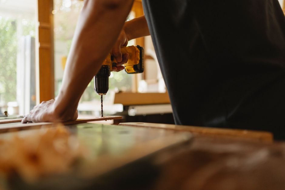 Professional carpenter installing a wooden door frame